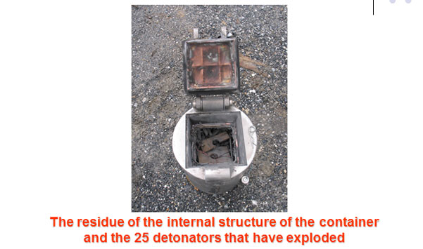 The residue of the internal structure of the container after the 25 detonators have exploded