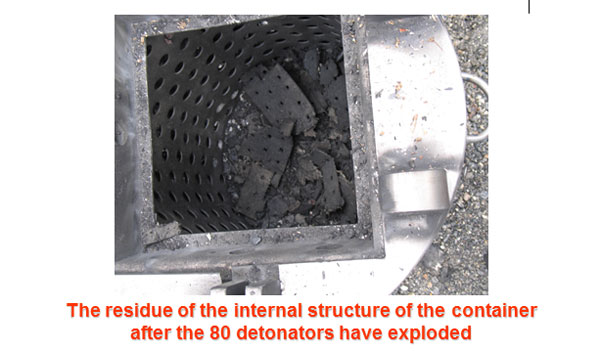 The residue of the internal structure of the container after the 80 detonators have exploded